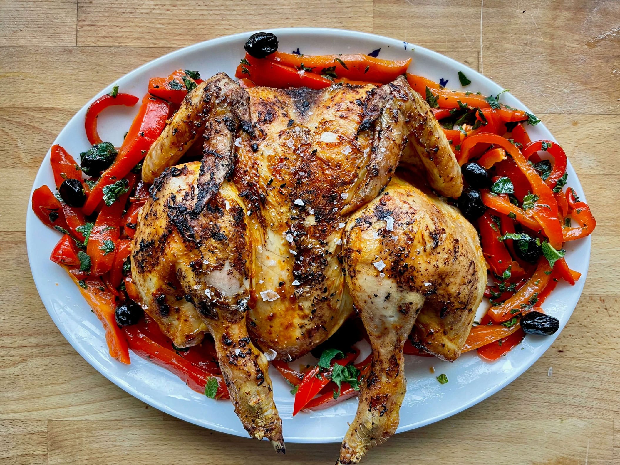 Spatchcock Chicken with Charred Peppers, Mint and Olives